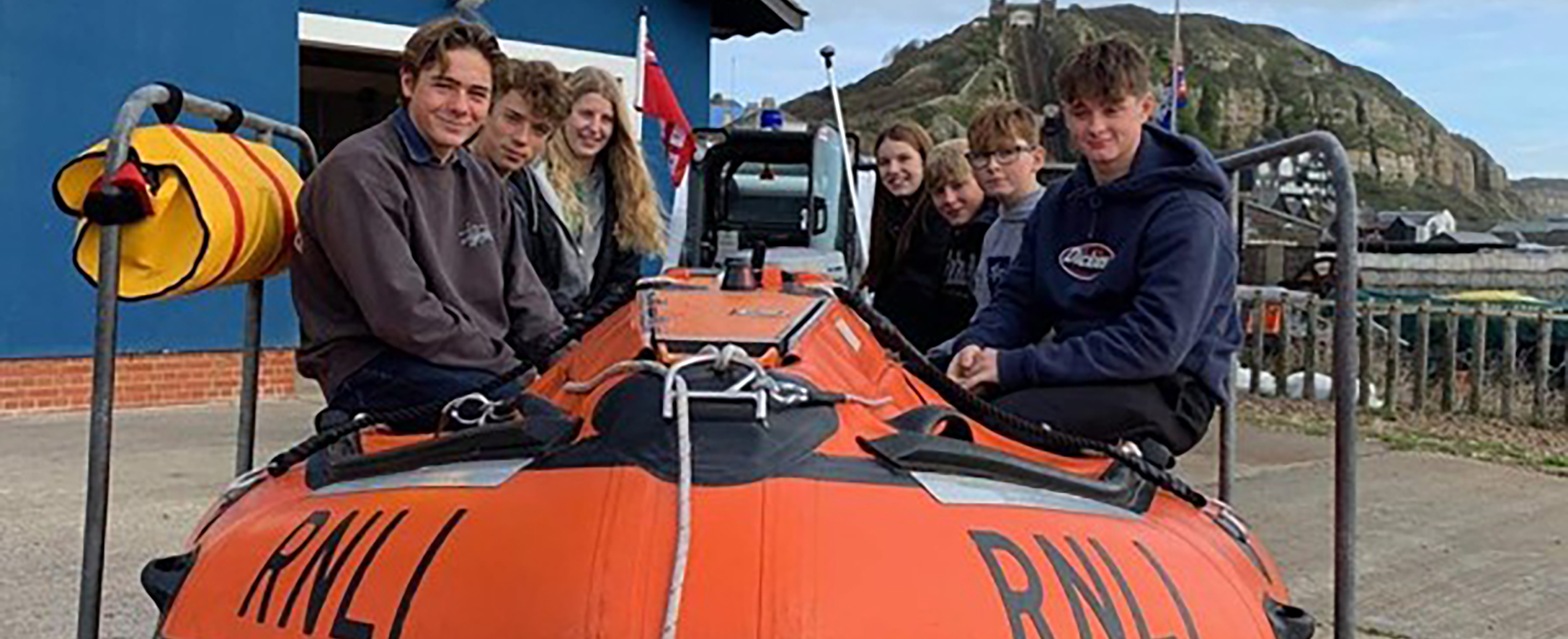 A group of people on a lifeboat