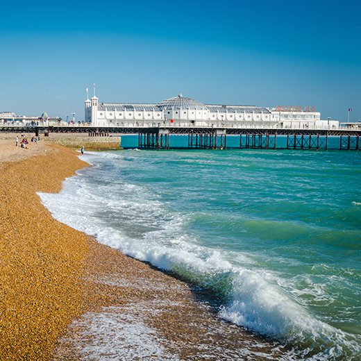 A pier and the beach next to the sea